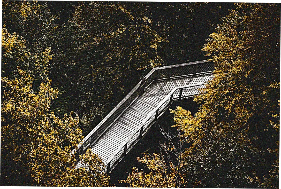 How are floating walkways anchored in place?